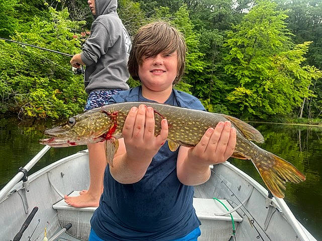 Gary is registered to the contest to win money with this photo: big_game_fishing, boat, fish, fisherman, fishing, hat, jigging, joy, lake, leisure, outdoor_recreation, person, plant, ray_finned_fish, recreation, recreational_fishing, shorts, smile, t_shirt, tree