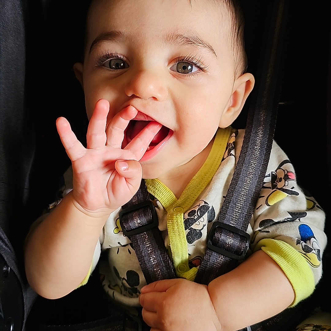 Ivan is registered to the contest to win money with this photo: accessories, baby, belt, bodypart, car, car_interior, carseat, face, finger, hand, happy, head, mouth, person, photography, portrait, smile, transportation, vehicle, wrist