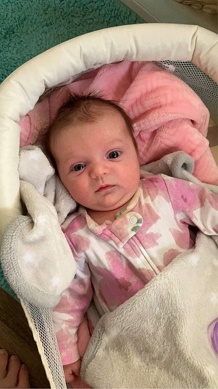 Stella is registered to the contest to win money with this photo: baby, baby_safety, baby_toddler_clothing, beauty, cheek, comfort, eye, eyebrow, face, gesture, iris, linens, nose, outerwear, person, pink, product, skin, sleeve, textile