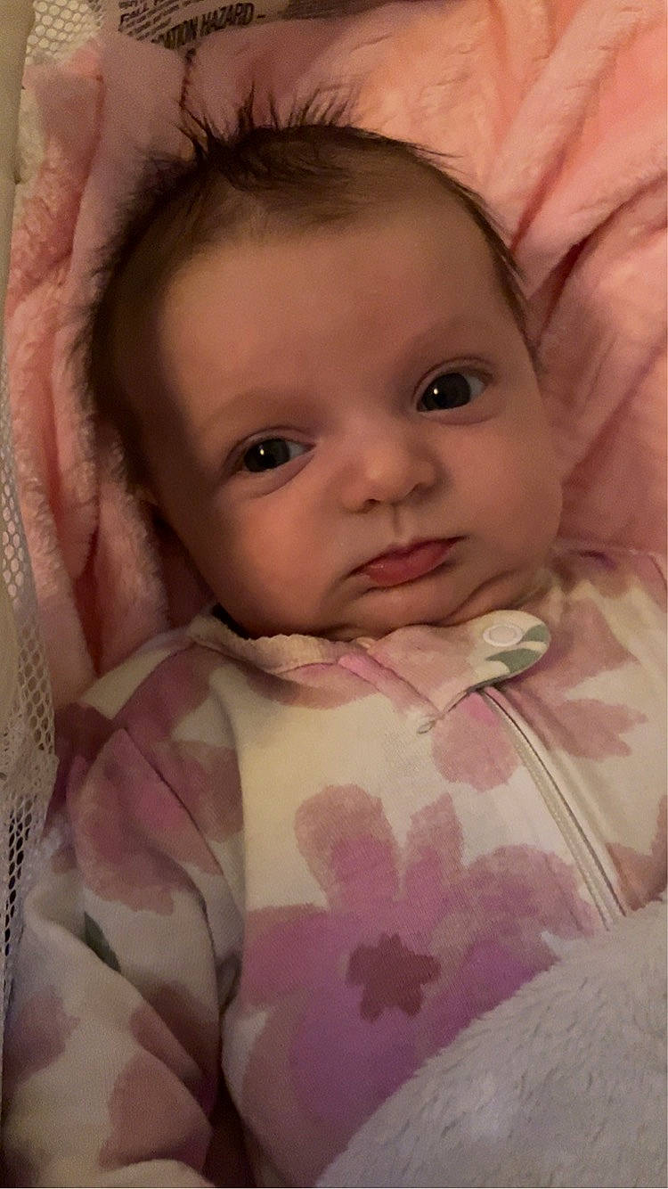 Stella joined the competition — help win amazing prizes! arm, baby, cheek, chin, dress, eyebrow, eyelash, gesture, hair, hand, human_body, iris, lip, mouth, nose, person, product, skin, sleeve, smile