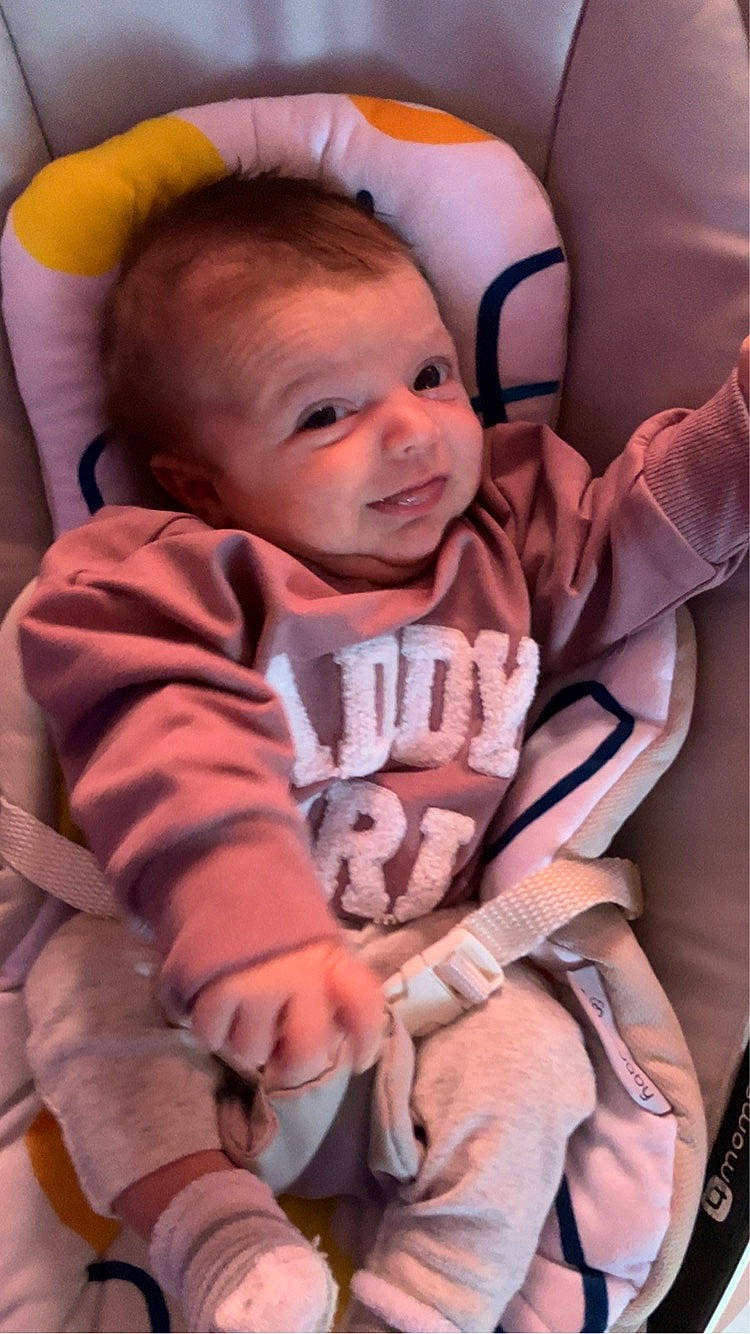 Stella joined the competition — help win amazing prizes! baby, baby_products, baby_toddler_clothing, cheek, child, comfort, eye, face, fun, happy, head, iris, lap, mouth, person, pink, skin, sleeve, smile, textile