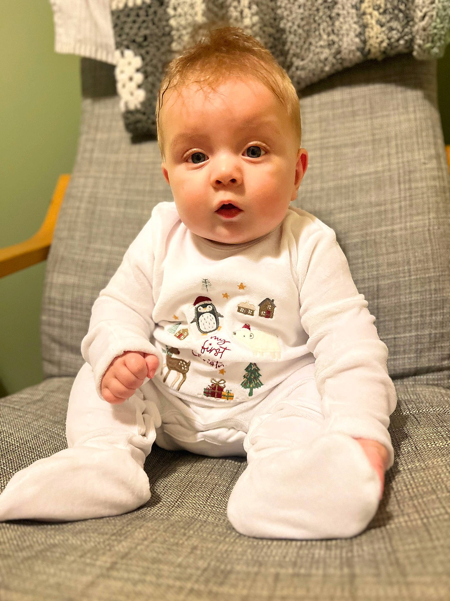 Ellis joined the competition — help win amazing prizes! baby, baby_toddler_clothing, cheek, child, comfort, couch, face, facial_expression, floor, flooring, foot, linens, mammal, person, sitting, skin, sleeve, sock, surprise, t_shirt