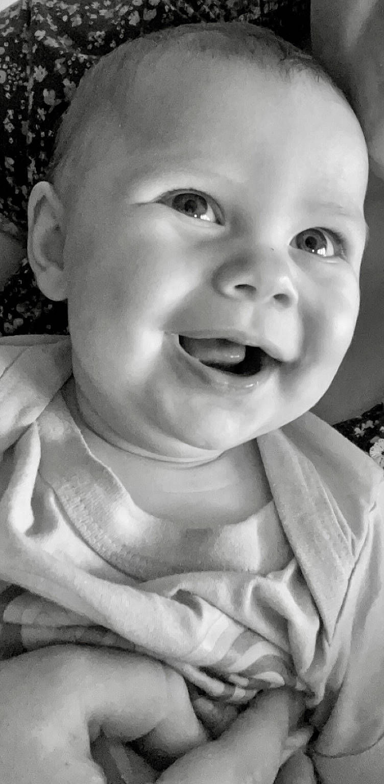 Kenzley is registered to the contest to win money with this photo: arm, baby, black_and_white, cheek, face, flash_photography, gesture, happy, head, human_body, jaw, lip, mouth, nose, person, photograph, skin, smile, style, toddler