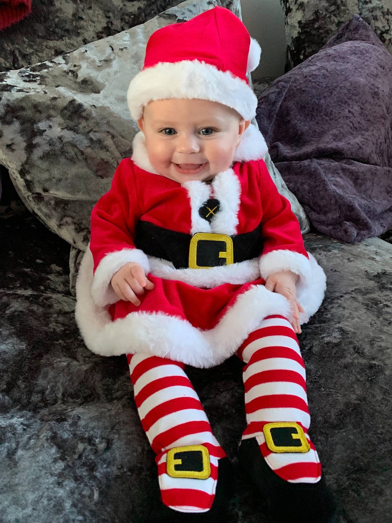 Skye joined the competition — help win amazing prizes! child, christmas, christmas_decoration, fictional_character, holiday, infant, joy, lap, person, product, red, santa_claus, smile, toddler