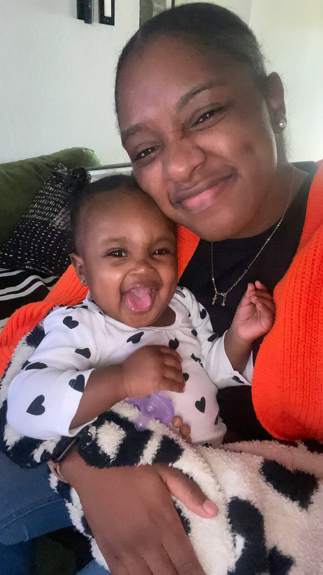 Rumani is registered to the contest to win money with this photo: accessories, baby, bodypart, couch, cushion, face, finger, furniture, hand, happy, head, homedecor, jewelry, laughing, necklace, people, person, photography, portrait, smile