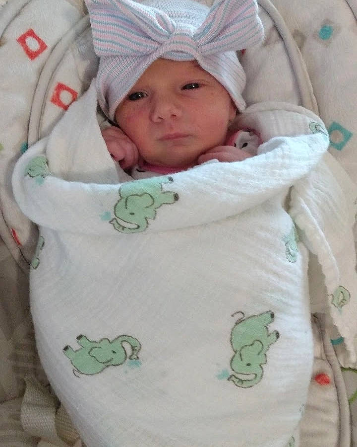 Cora joined the competition — help win amazing prizes! baby, baby_products, baby_safety, baby_sleeping, baby_toddler_clothing, cheek, child, comfort, green, headwear, linens, person, product, sleeve, textile, thumb, toddler, white