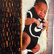 Titan joined the competition — help win amazing prizes! newborn, baby, sleeping, basket, woven, black_clothing, nike, infant, cozy, fluffy, white_fabric, hands, feet, portrait, cute, resting, indoors, closeup, child, soft