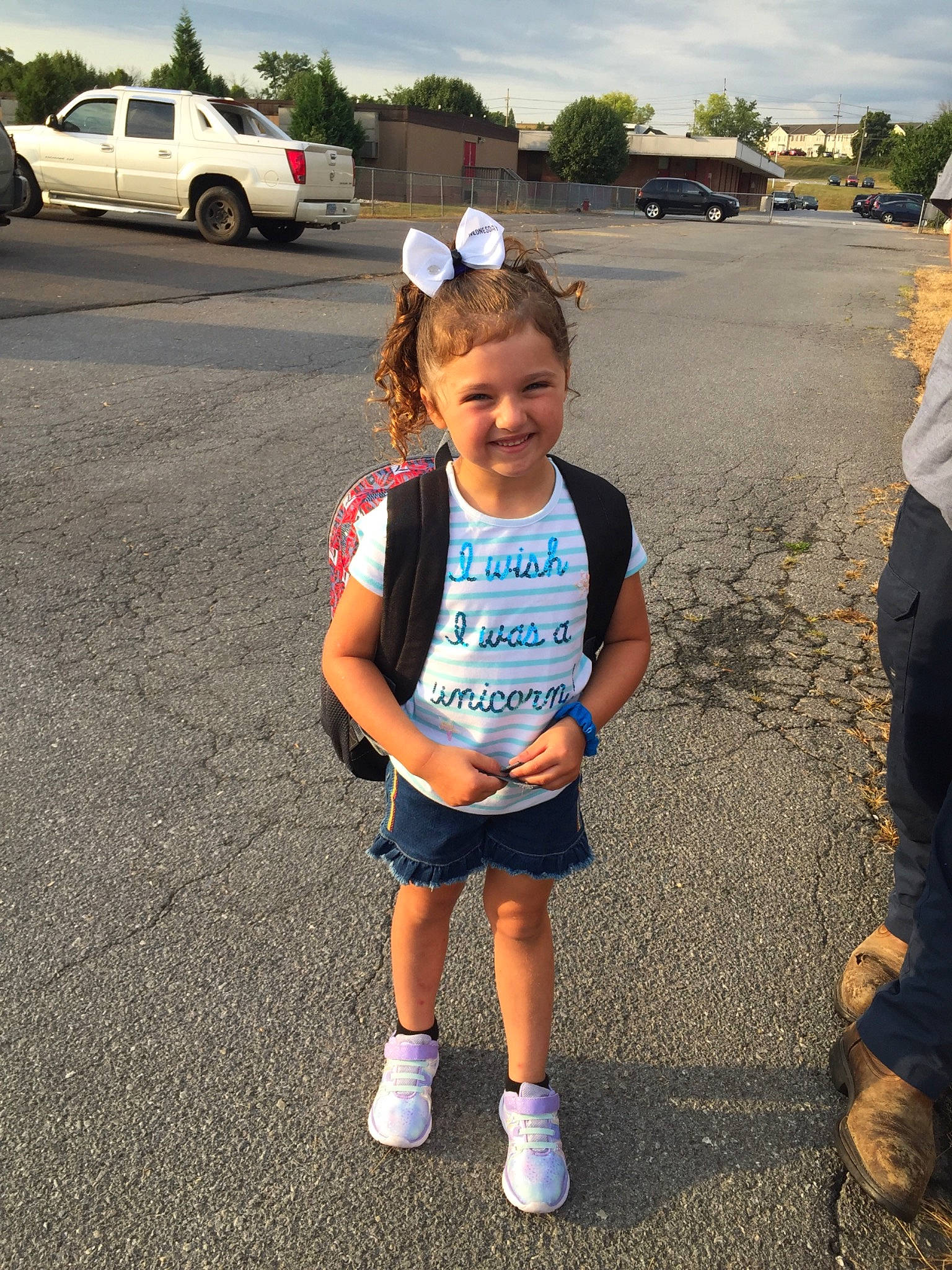 June is registered to the contest to win money with this photo: asphalt, car, child, city_car, family_car, joy, luxury_vehicle, person, plant, recreation, road, vacation, vehicle