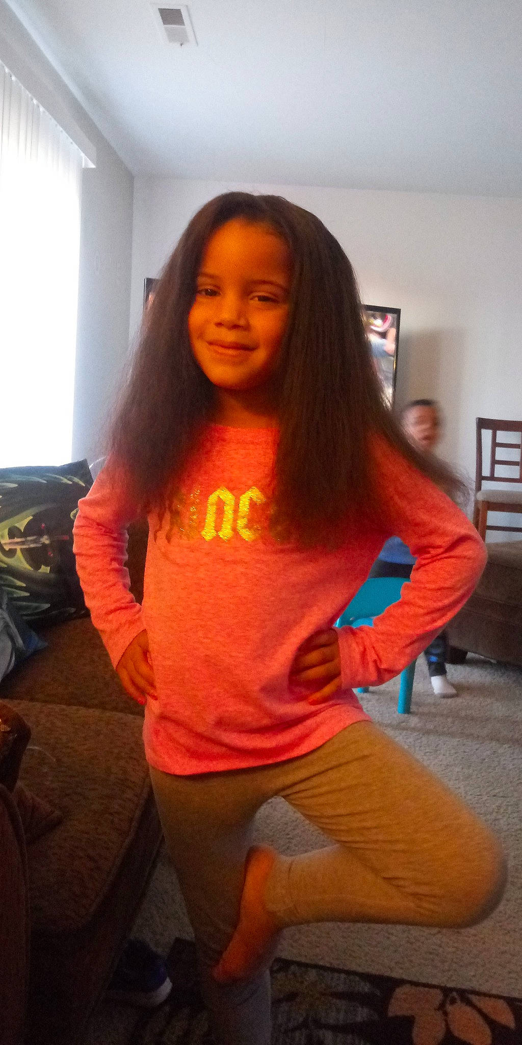 Kaydence joined the competition — help win amazing prizes! black_hair, brown_hair, finger, hair, hairstyle, joint, joy, leg, long_hair, orange, person, selfie, shoulder, sitting, sportswear, t_shirt, thigh