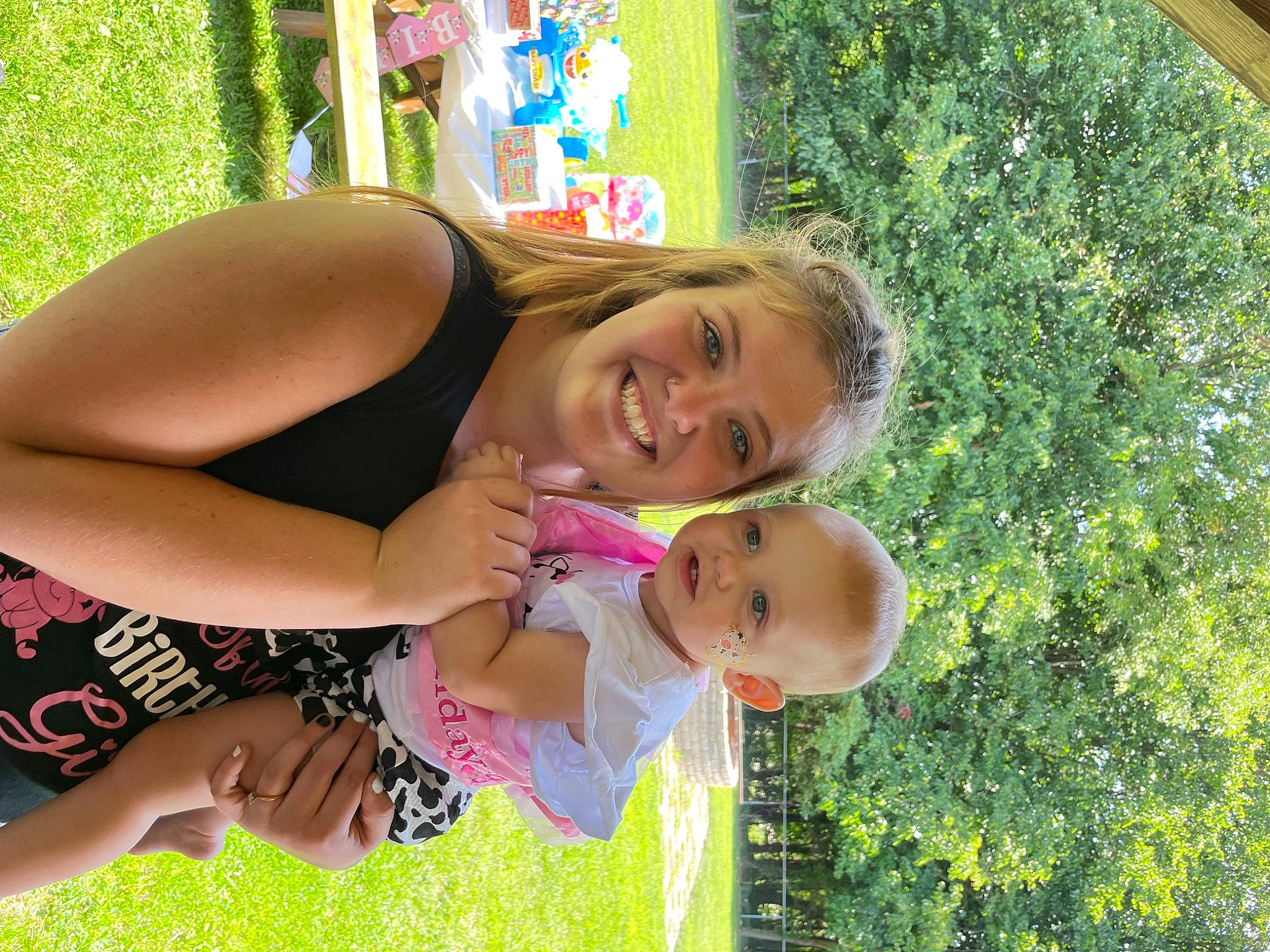 Kynzlee is registered to the contest to win money with this photo: arm, baby, child, event, fun, garden, grass, happy, joy, leisure, people_in_nature, person, plant, recreation, sitting, smile, summer, thigh, toddler, tree