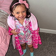 Katalina joined the competition — help win amazing prizes! bed, bedroom, blanket, carpet, child, clothing, cute, happy, headband, indoor, pajamas, person, pink, pink_bow, playful, robe, smiling, standing, toddler, young_child