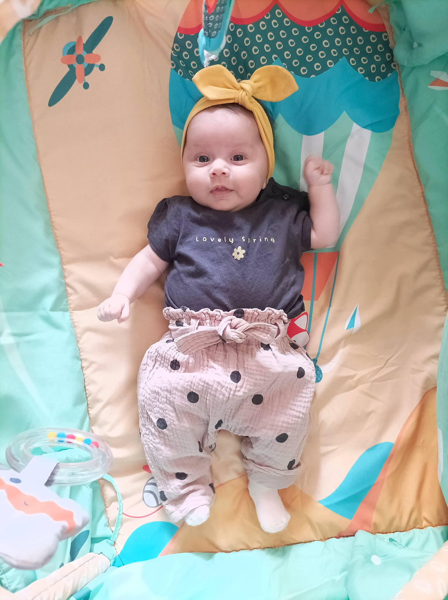 Mia participe au concours pour gagner de l'argent avec cette photo : azure, baby, baby_toddler_clothing, blue, child, comfort, fun, happy, linens, pattern, people, person, pillow, pink, product, purple, sleeve, t_shirt, textile, toddler