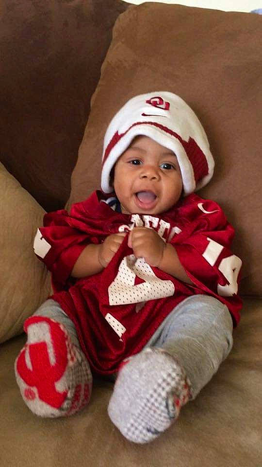 Tatum is registered to the contest to win money with this photo: beanie, bonnet, cap, child, christmas, crochet, hat, headgear, headwear, holiday, infant, knit_cap, person, product, red, toddler