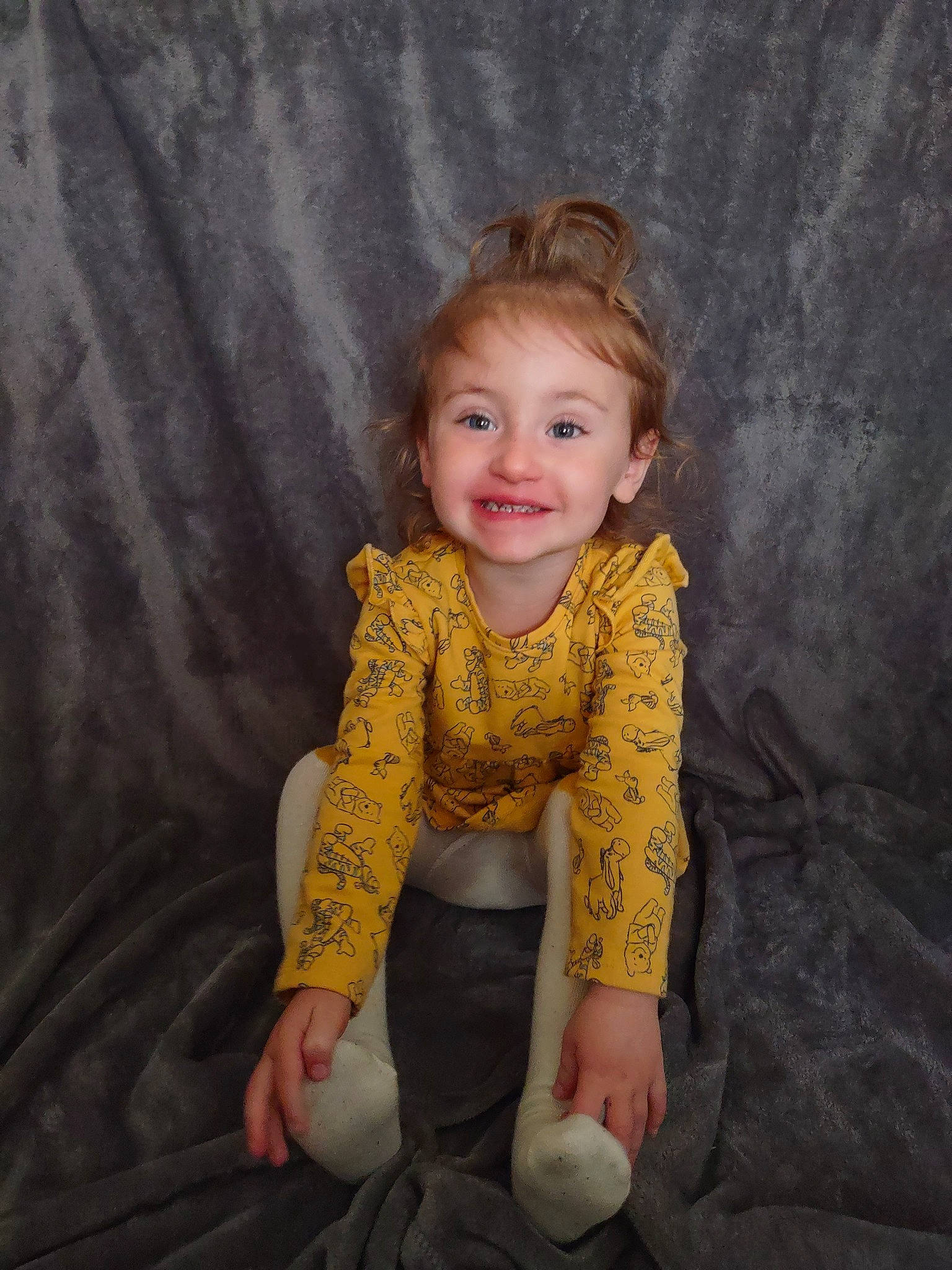 Aubrey is registered to the contest to win money with this photo: arm, baby_toddler_clothing, comfort, eye, fawn, finger, flash_photography, flooring, hair, hand, happy, head, joy, leg, neck, organ, person, skin, sleeve, smile
