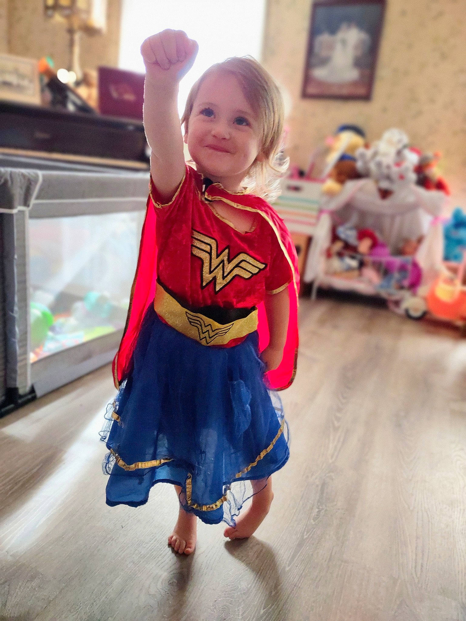 Aubrey is registered to the contest to win money with this photo: baby_toddler_clothing, child, dress, electric_blue, event, floor, flooring, fun, happy, head, human_leg, joint, joy, leg, person, skin, sleeve, smile, thigh, toddler