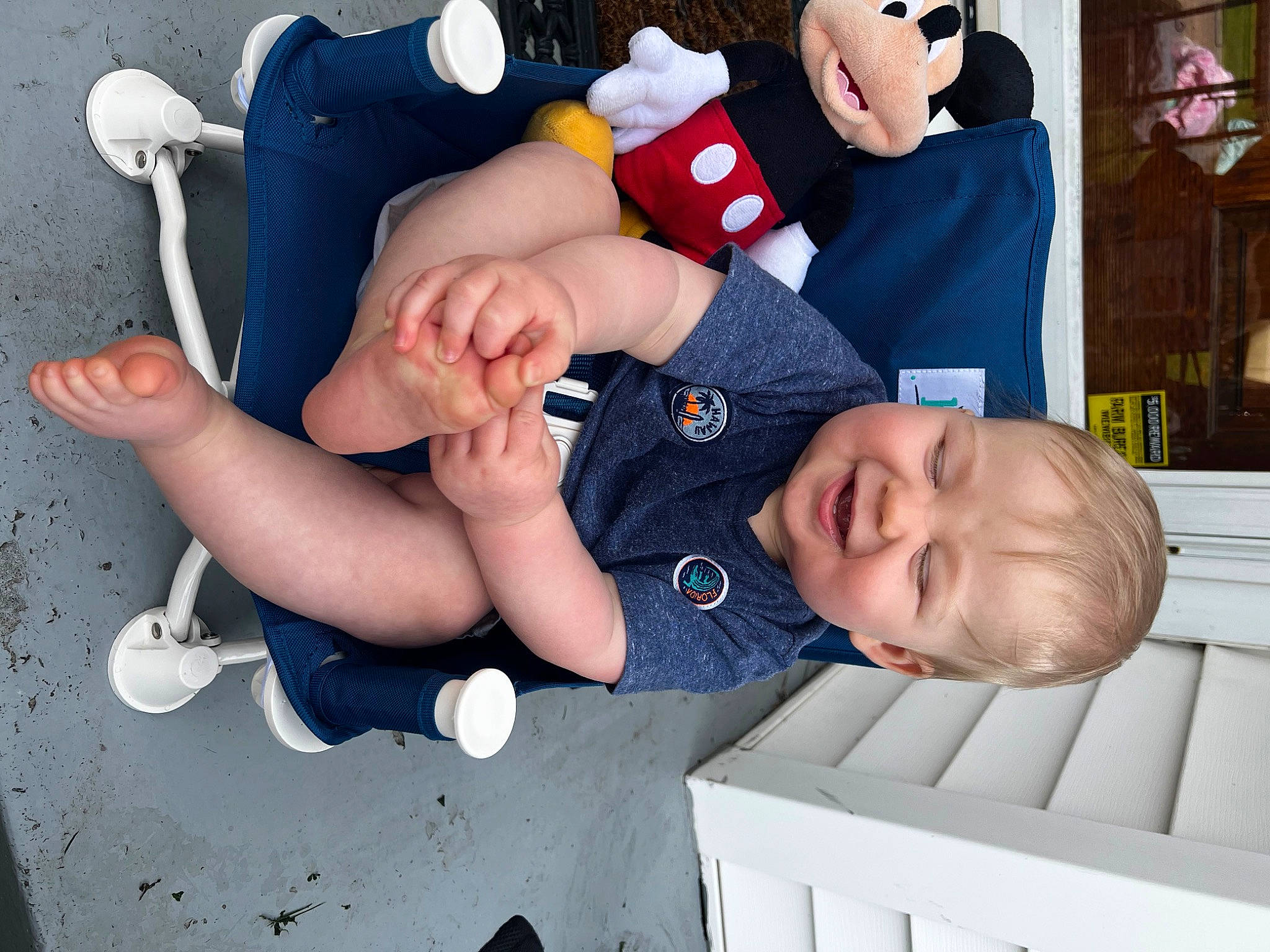 Archie is registered to the contest to win money with this photo: arm, baby, baby_products, baby_toddler_clothing, blue, child, comfort, face, fun, hand, happy, person, photograph, portrait_photography, room, sitting, sleeve, snapshot, thumb, toddler