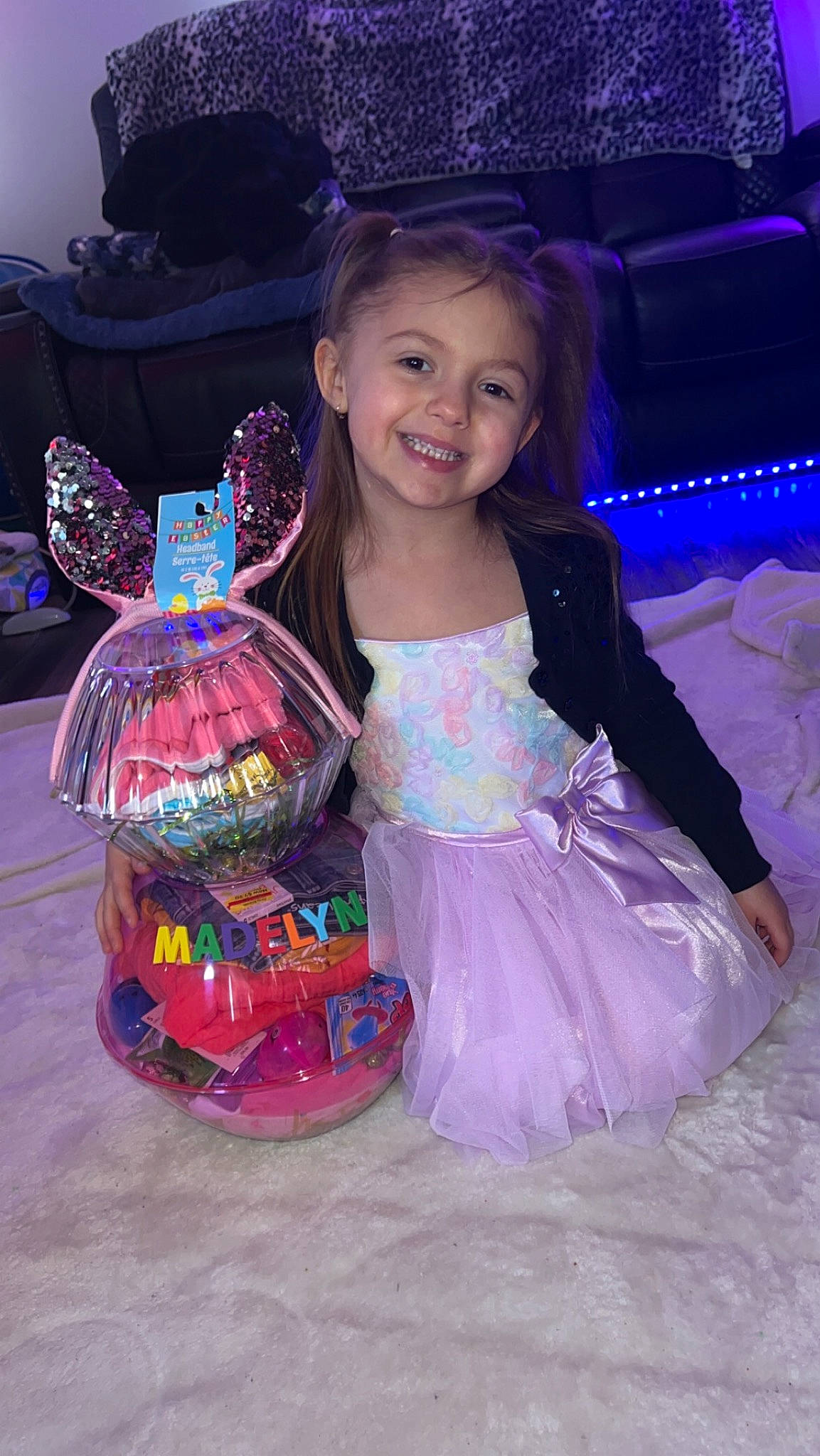 Madelyn is registered to the contest to win money with this photo: baby_toddler_clothing, child, costume, event, face, fashion_accessory, flash_photography, fun, happy, head, holiday, joy, leisure, magenta, party, person, pink, purple, sitting, smile