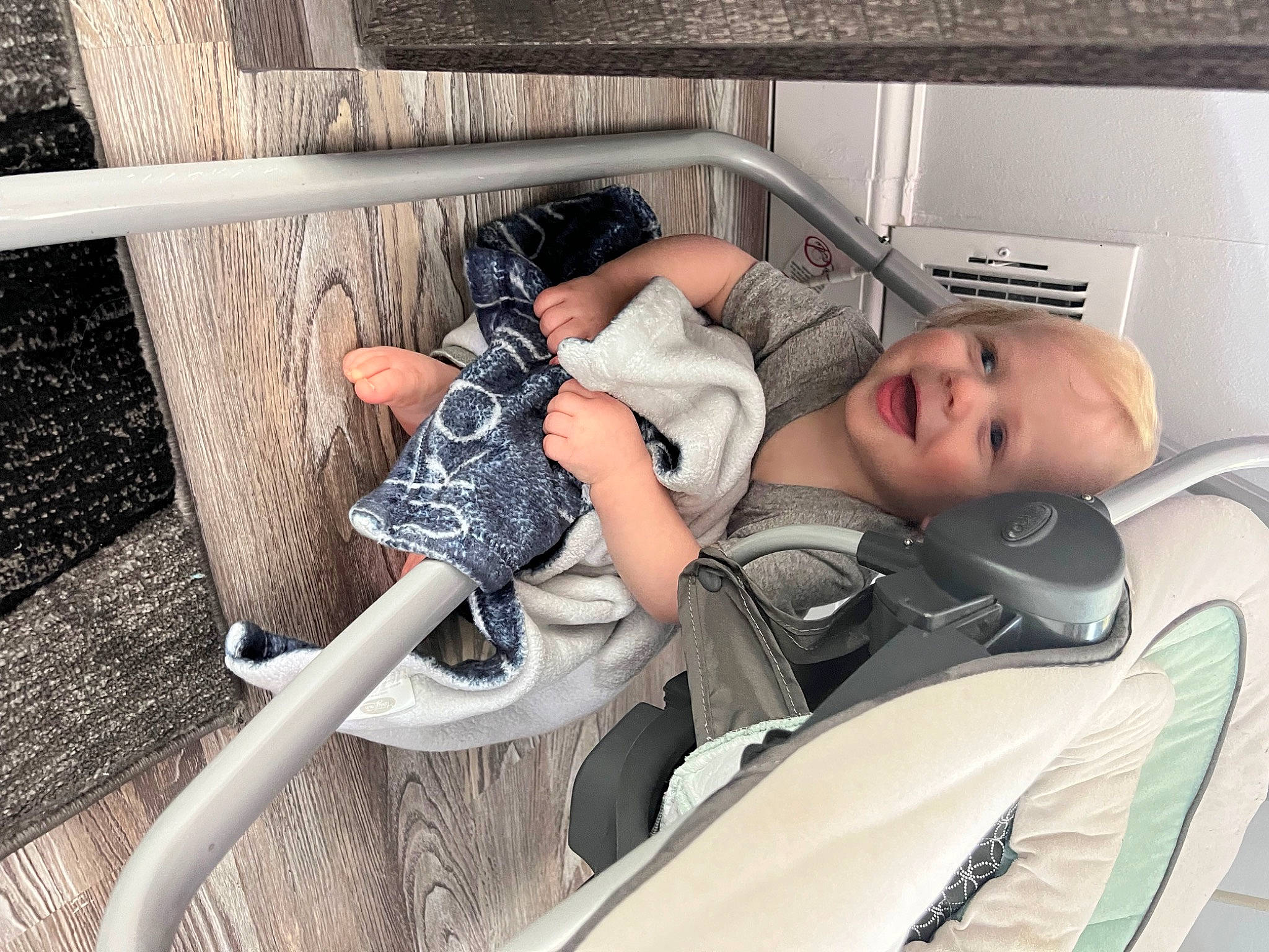 Luka is registered to the contest to win money with this photo: arm, automotive_design, baby, baby_products, child, comfort, fun, human_leg, knee, leg, leisure, nap, person, recreation, sandal, shoe, sitting, sneakers, thigh, toddler