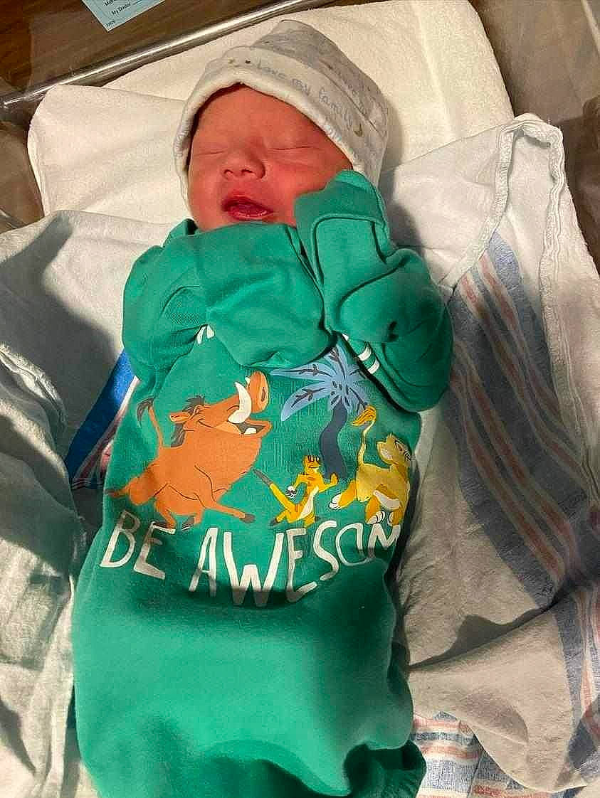 Gio is registered to the contest to win money with this photo: baby, baby_products, baby_sleeping, baby_toddler_clothing, child, comfort, electric_blue, hood, linens, person, polar_fleece, room, sleep, sleeve, t_shirt, toddler, top