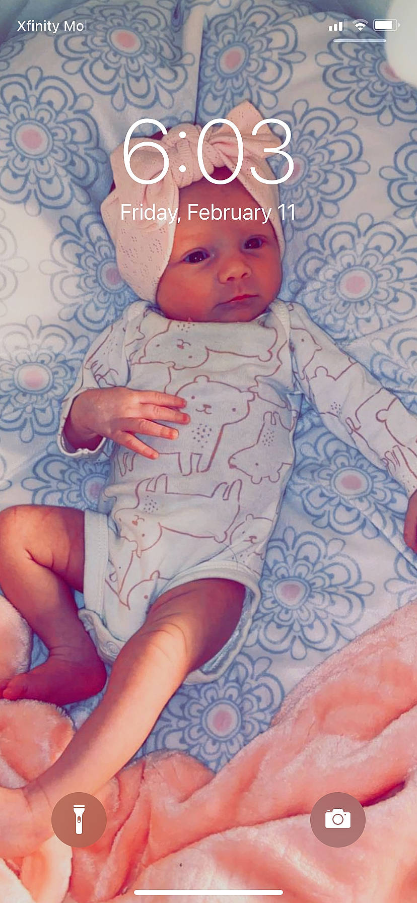 Jacqueline is registered to the contest to win money with this photo: arm, baby, baby_toddler_clothing, cheek, facial_expression, finger, hairstyle, hand, headwear, human_body, joint, leg, mouth, muscle, nail, person, pink, skin, textile, thigh