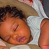 Russell is registered to the contest to win money with this photo: baby, bedding, blanket, child, close_up, closed_eyes, curly_hair, cute, face, indoors, infant, nap, pajamas, peaceful, pillow, portrait, resting, sleeping, soft_lighting, striped_clothing