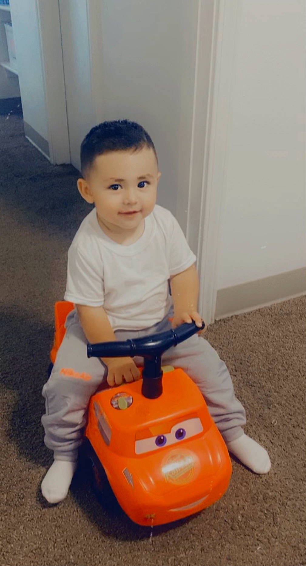 Occitan joined the competition — help win amazing prizes! automotive_design, baby, baby_playing_with_toys, child, cleanliness, floor, flooring, fun, home_appliance, joy, person, plastic, riding_toy, shoe, smile, sneakers, tire, toddler, toy, toy_vehicle