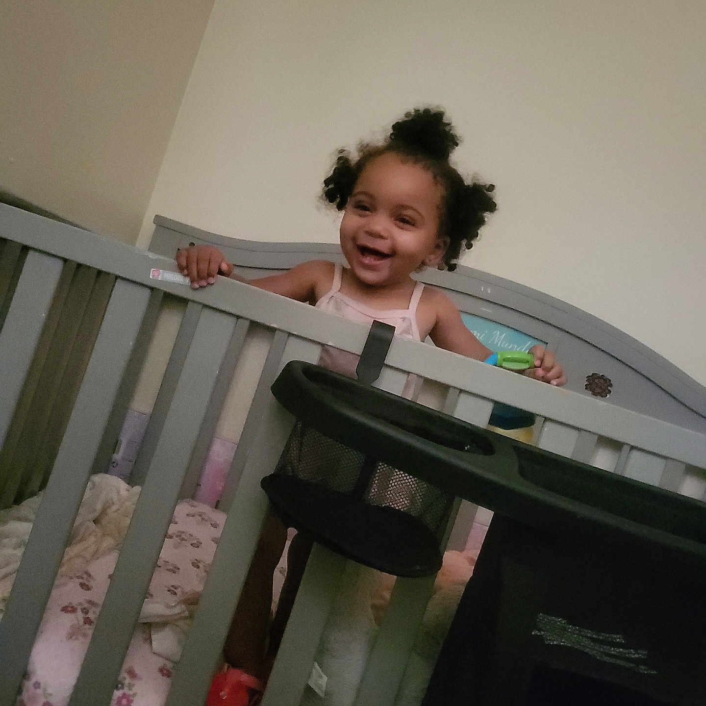 A'Zyriah is registered to the contest to win money with this photo: baby, bedroom, blanket, child, crib, cute, furniture, grip, hair, happy, home, indoor, infant, person, playful, sleeping_area, smiling, toddler, toy, young_child
