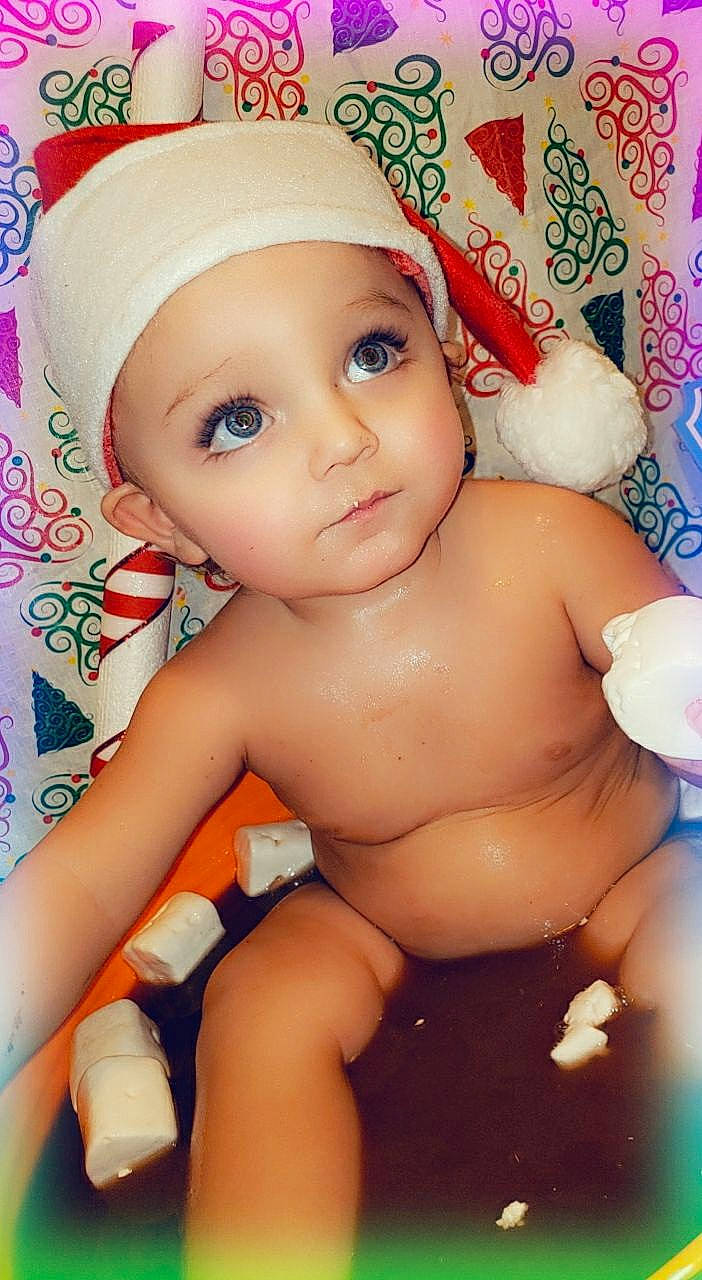 Zaydin is registered to the contest to win money with this photo: arm, baby, cap, cheek, chest, eyebrow, eyelash, facial_expression, finger, happy, headgear, headwear, lip, mouth, muscle, nose, organ, person, pink, skin