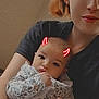 baby, woman, selfie, portrait, holding, red_horns, doodle, cute, indoor, casual, clothing, face, expression, child, mother, family, closeup, person, together, love