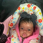 Amoura Mays joined the competition — help win amazing prizes! baby, infant, car_seat, headband, pink_hoodie, floral_pattern, child, face, eyes, clothing, seatbelt, cute, indoors, person, young_child, headwear, expression, closeup, sitting, bundle