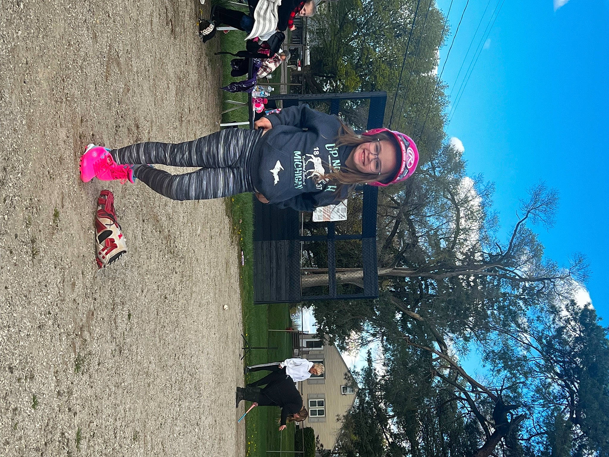 Lucille is registered to the contest to win money with this photo: adventure, bicycle_wheel, carmine, extreme_sport, fun, headwear, helmet, joy, leisure, outdoor_shoe, person, recreation, sky, soil, sport_climbing, street_light, tire, tree, walking_shoe, wheel