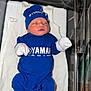 newborn, baby, sleeping, blue_clothing, hat, mittens, socks, bassinet, hospital, blanket, soft_lighting, infant, cute, portrait, babywear, resting, child, person, young, indoors