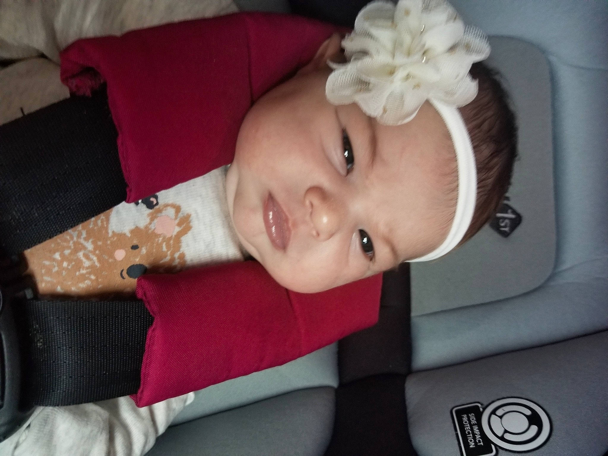 Alayah is registered to the contest to win money with this photo: auto_part, baby, baby_products, baby_toddler_clothing, car_seat, cheek, child, comfort, eye, eyelash, fashion_accessory, happy, hat, headband, headpiece, headwear, pattern, person, sleeve, smile