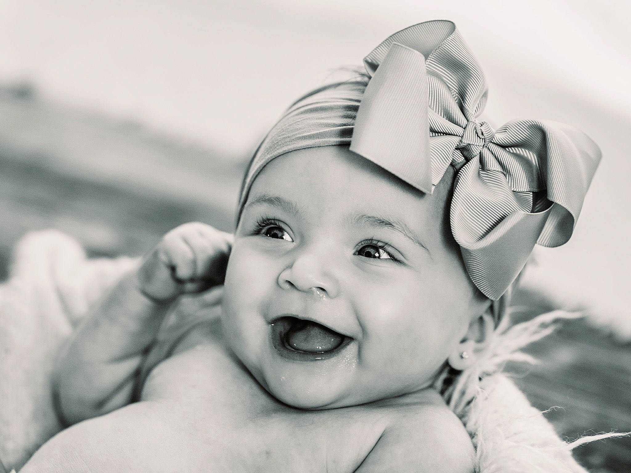 Kimber is registered to the contest to win money with this photo: art, baby, baby_laughing, child, ear, eye, eyelash, fashion_accessory, flash_photography, fun, gesture, happy, headband, headpiece, headwear, iris, monochrome, monochrome_photography, person, smile