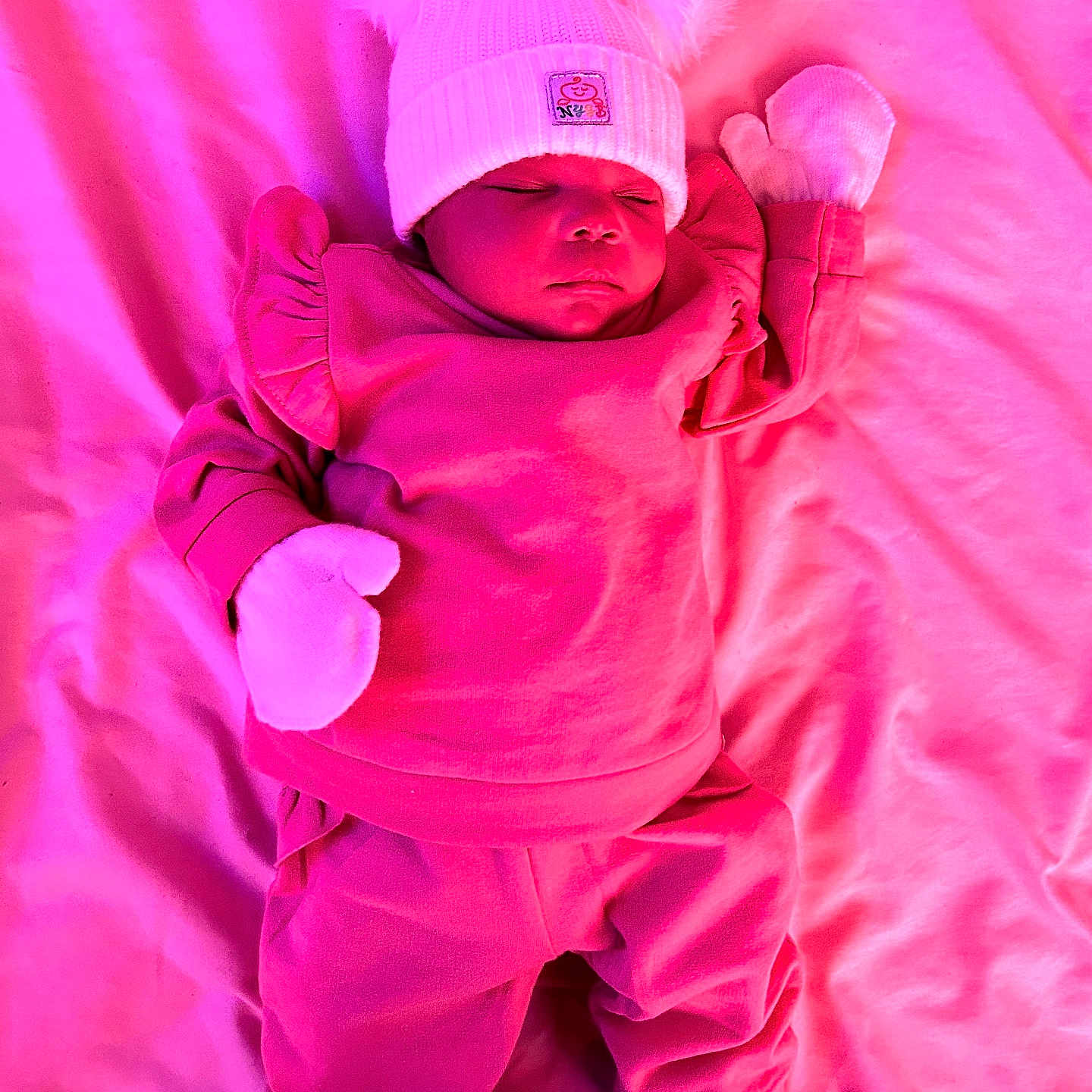 Kaylani joined the competition — help win amazing prizes! baby, blanket, bodypart, bonnet, cap, clothing, face, finger, furniture, glove, hand, hat, head, hood, newborn, person, photography, portrait, purple, sleeping