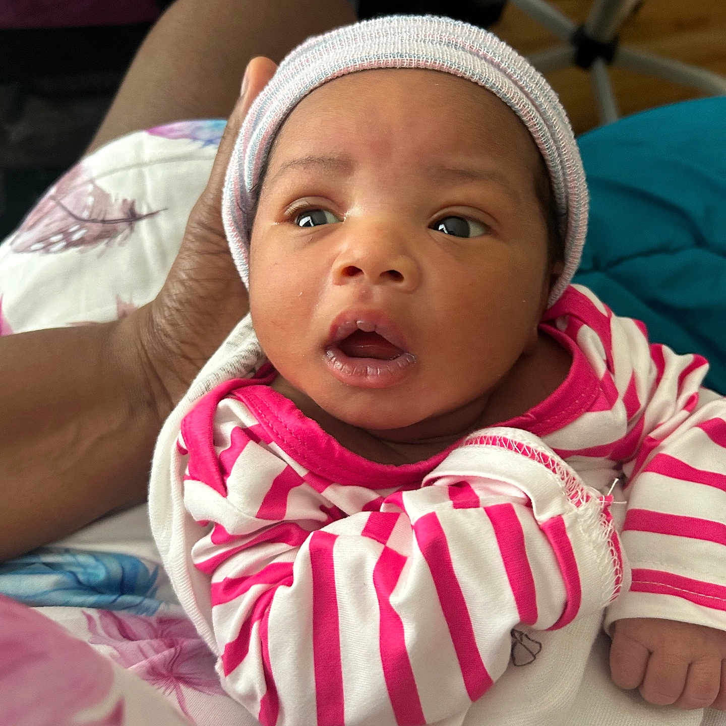 Chakayla is registered to the contest to win money with this photo: architecture, baby, bodypart, bonnet, building, cap, clothing, couch, cushion, face, furniture, glove, hat, head, homedecor, hospital, newborn, person, photography, portrait