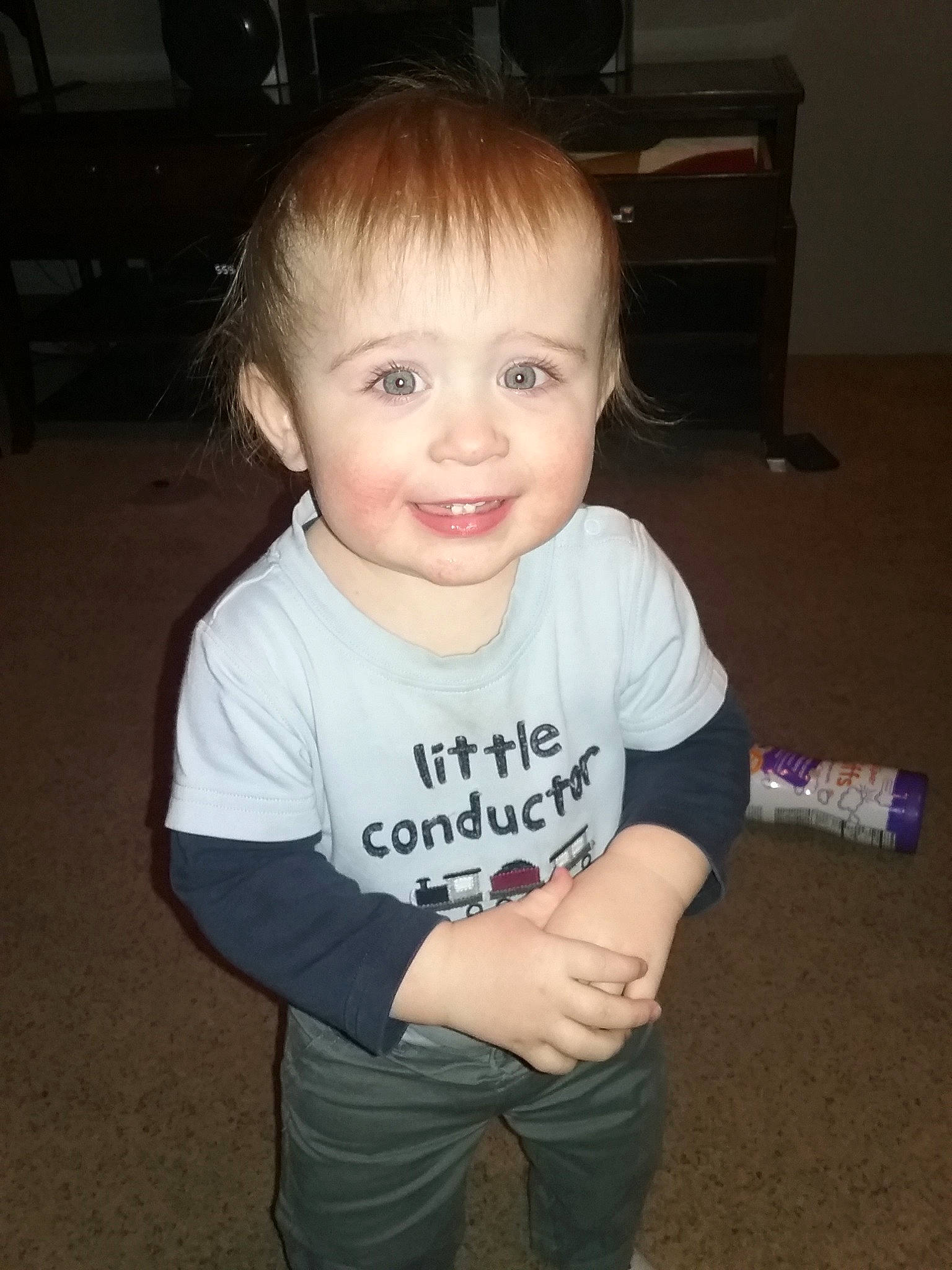 Graysin is registered to the contest to win money with this photo: arm, baby, cheek, child, cool, face, forehead, fun, hair, hairstyle, head, joy, person, skin, sleeve, smile, standing, t_shirt, toddler, top