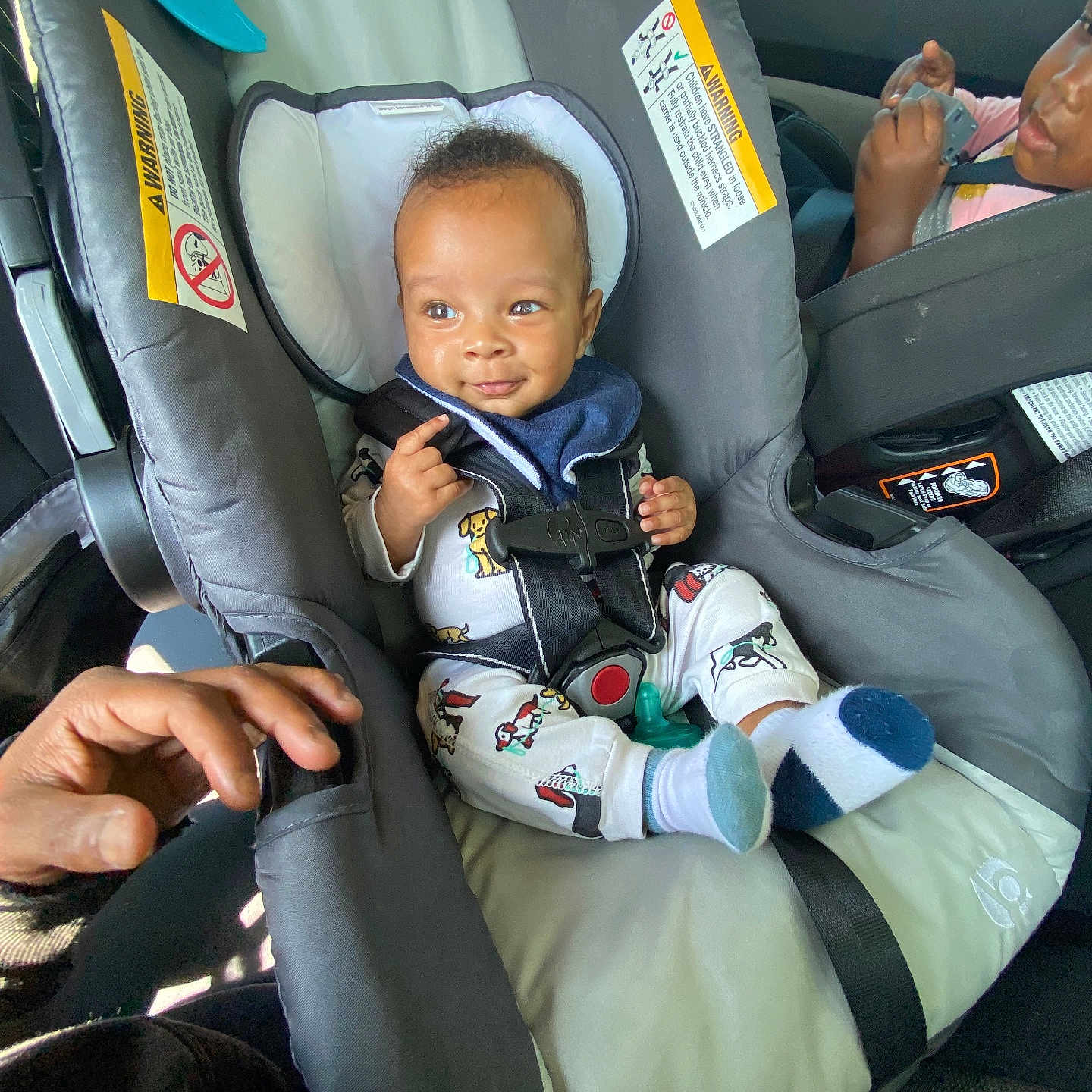 Semaj joined the competition — help win amazing prizes! automobile, baby, car_interior, car_seat, child, child_seat, cute, hand, happy, infant, inside, pajamas, person, safety_harness, seatbelt, smiling, socks, toddler, vehicle, young_child