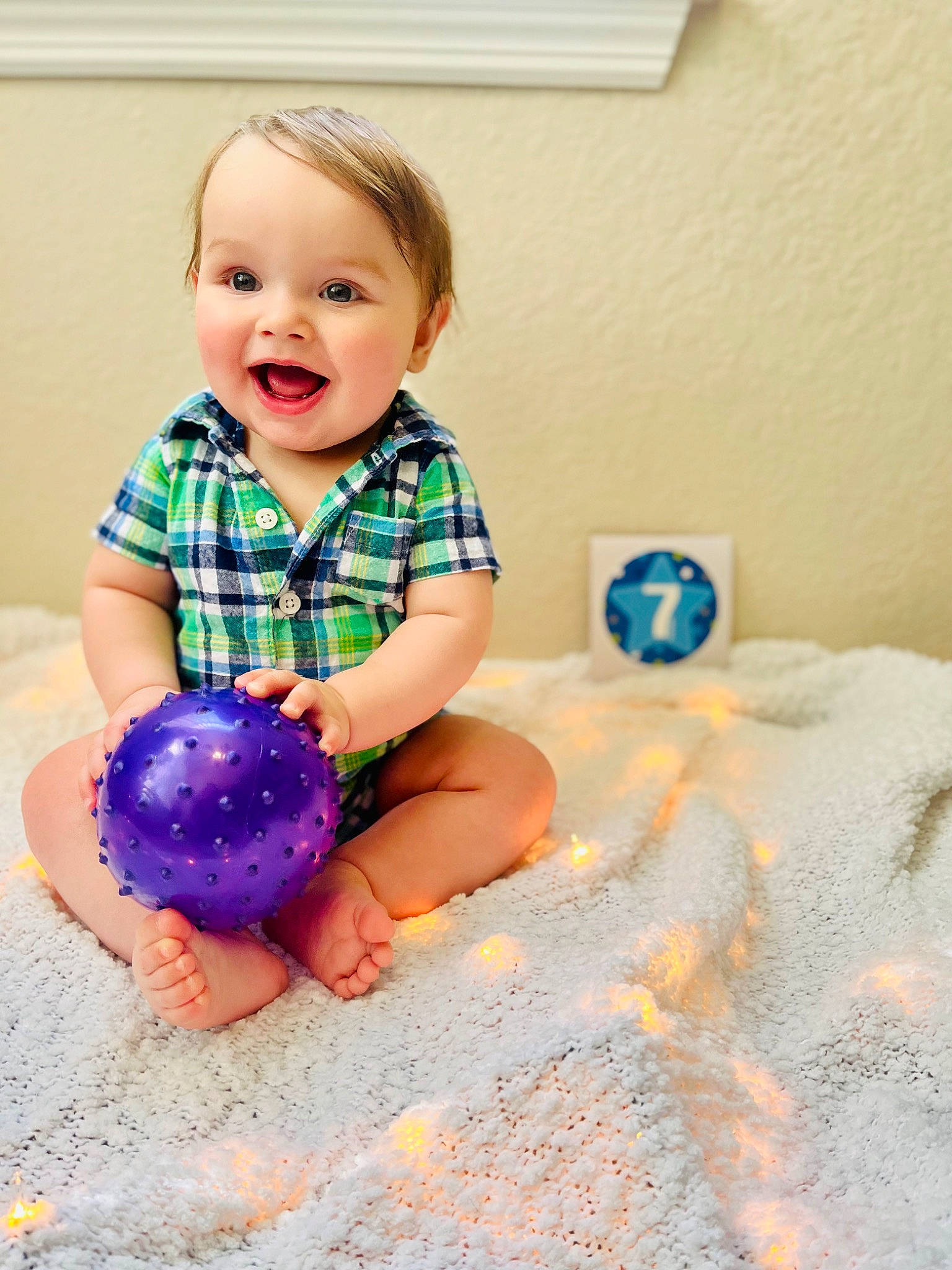 Quinton joined the competition — help win amazing prizes! azure, baby, baby_playing_with_toys, baby_toddler_clothing, barefoot, child, dress, electric_blue, floor, flooring, fun, happy, human_leg, pattern, person, picture_frame, purple, sleeve, smile, t_shirt