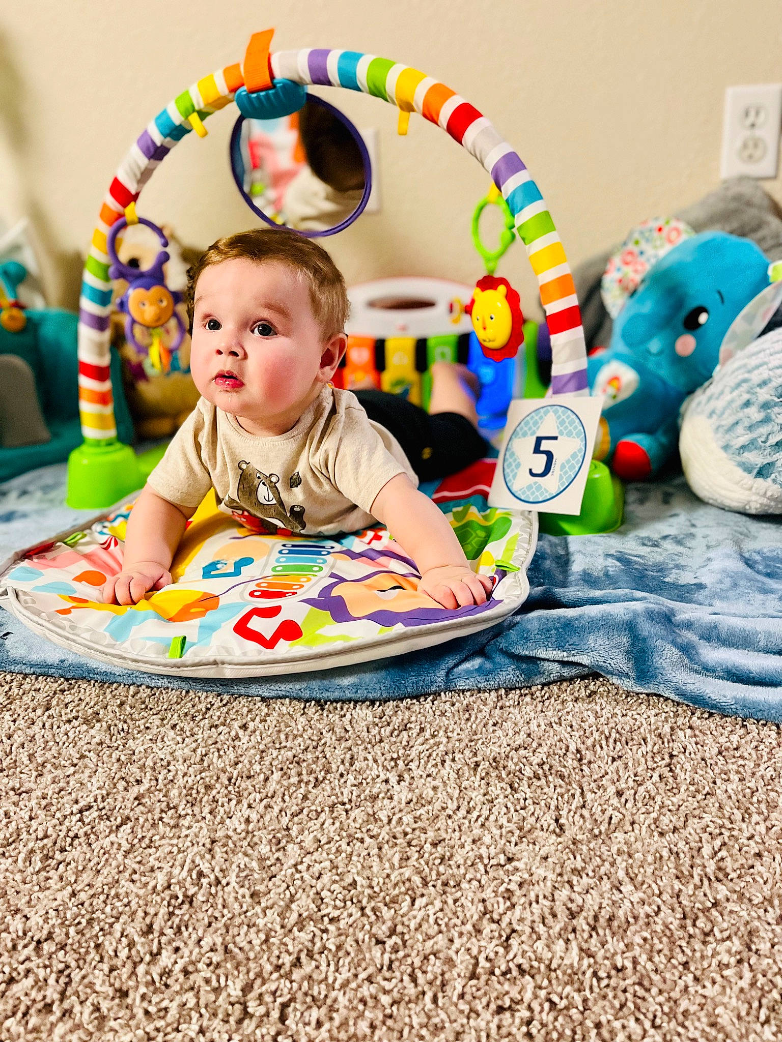 Quinton is registered to the contest to win money with this photo: baby, baby_playing_with_toys, baby_products, baby_toddler_clothing, chair, child, circle, comfort, event, fun, happy, head, person, play, recreation, room, sitting, sleeve, surprise, t_shirt
