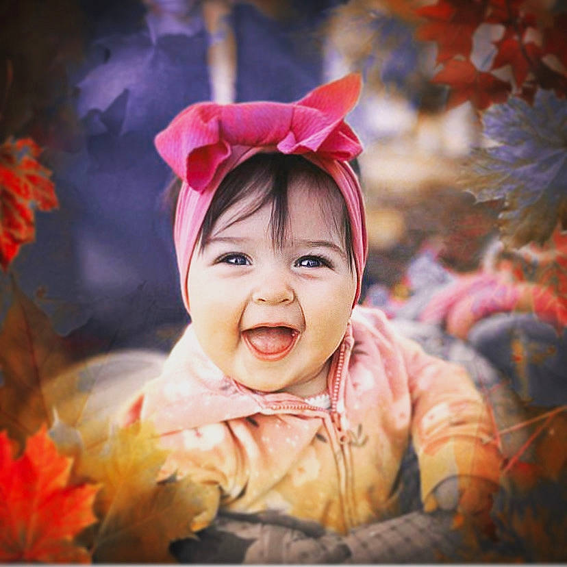 Sofia is registered to the contest to win money with this photo: baby, baby_laughing, baby_toddler_clothing, bonnet, cheek, child_model, costume_accessory, happy, headband, headgear, leaf, lip, mouth, nose, person, petal, pink, portrait, portrait_photography, toddler