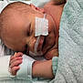 Finn is registered to the contest to win money with this photo: architecture, arm, baby, blanket, bodypart, building, clinic, face, finger, hand, head, hospital, indoors, newborn, person, photography, portrait, toe, towel, wrist