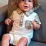 Gracen joined the competition — help win amazing prizes! baby, child, hat, plaid, shirt, collar, couch, seated, smiling, indoors, face, hands, legs, footwear, fashion, cute, portrait, person, young, infant