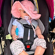 Charlotte joined the competition — help win amazing prizes! baby, car_seat, pink_hat, pacifier, toy, child, infant, straps, sitting, clothing, legs, feet, outdoor, sunhat, cute, safety, seat_belt, closeup, portrait, person