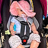 baby, car_seat, pink_hat, pacifier, toy, child, infant, straps, sitting, clothing, legs, feet, outdoor, sunhat, cute, safety, seat_belt, closeup, portrait, person