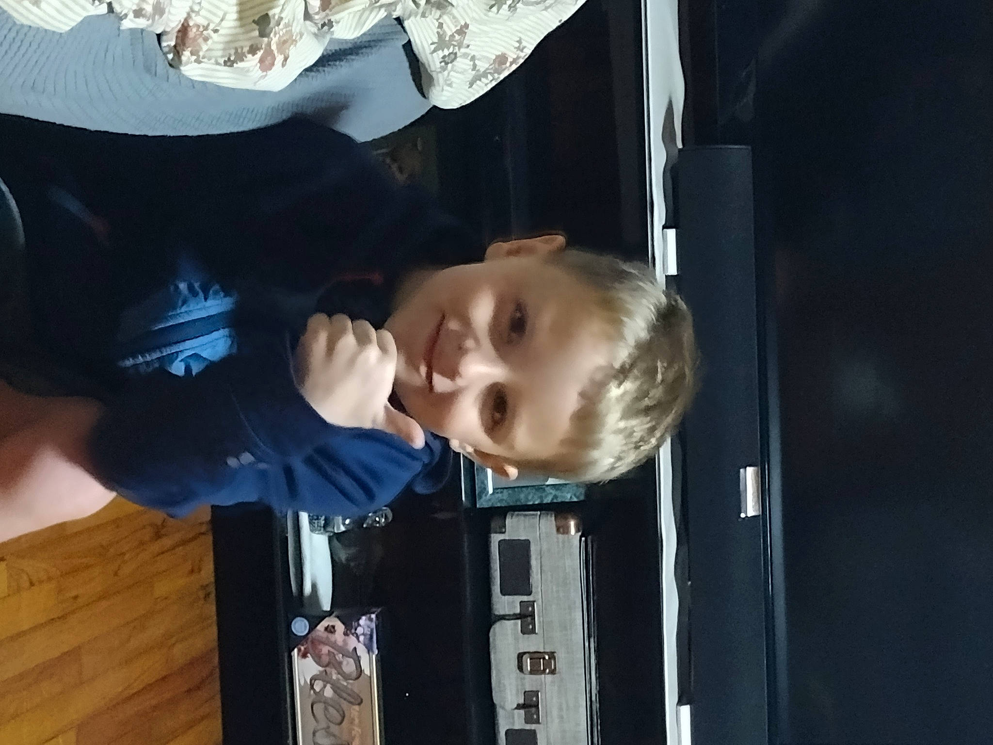 Aaron is registered to the contest to win money with this photo: child, electric_blue, fashion_accessory, fun, happy, joy, leisure, person, shade, smile, toddler, tree, vacation, wood