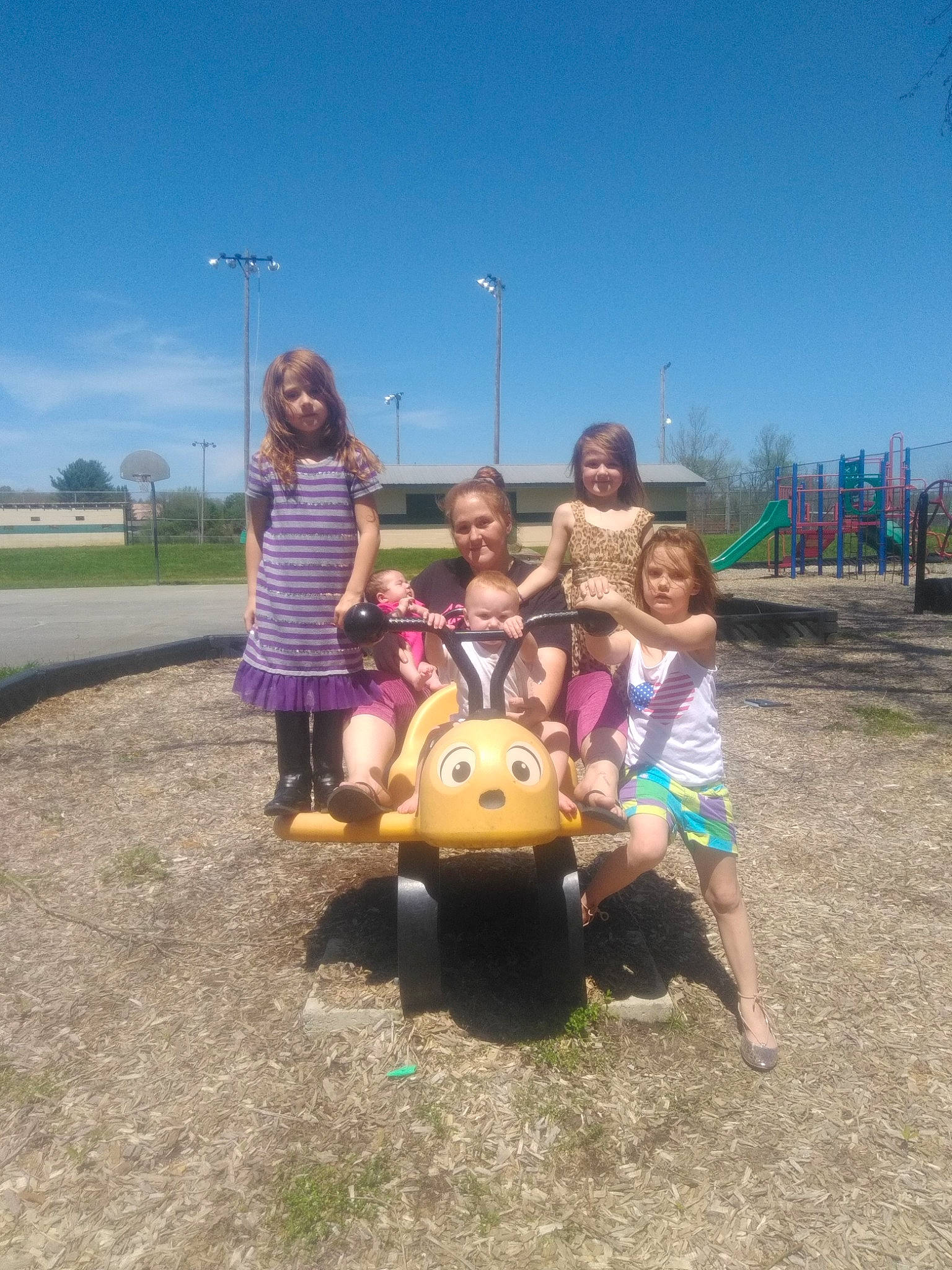Shyann joined the competition — help win amazing prizes! child, city, fun, joy, leisure, outdoor_play_equipment, person, play, playground, public_space, recreation, sky, smile, toddler, tree, vacation, vehicle