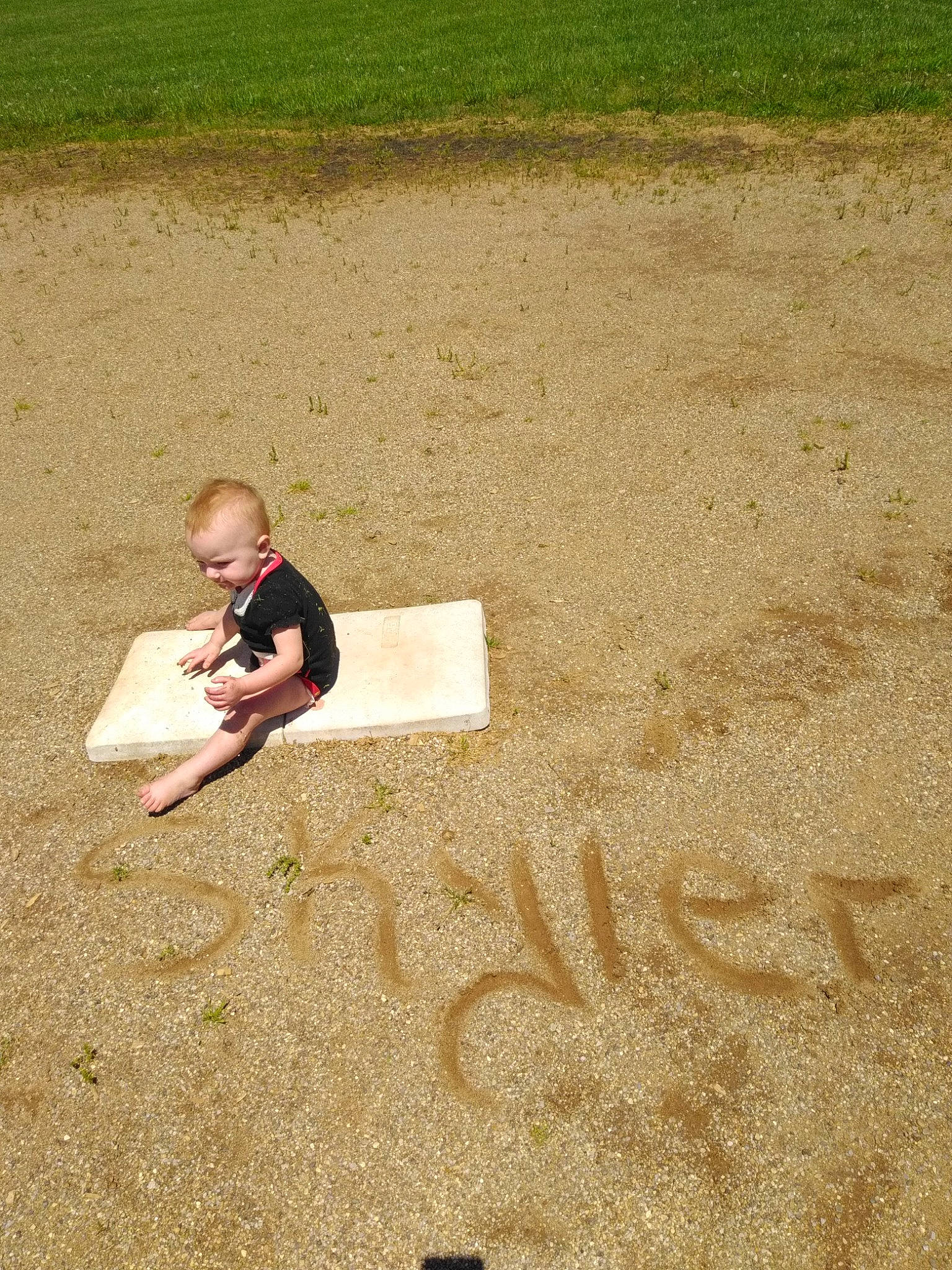 Skyler is registered to the contest to win money with this photo: baseball_field, beige, child, flooring, games, grass, grass_family, lawn, leisure, person, photography, plant, play, recreation, sand, sitting, soil, summer, toddler, vacation