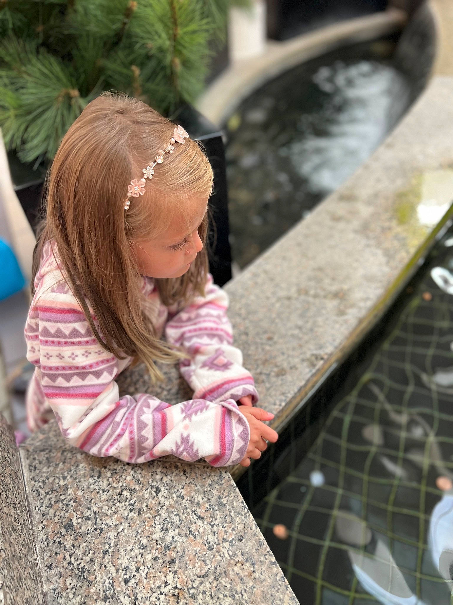 Katie joined the competition — help win amazing prizes! child, city, flooring, fun, grass, happy, leisure, person, plant, recreation, road_surface, sidewalk, sitting, street, temple, toddler, tourism, tree, vacation, water