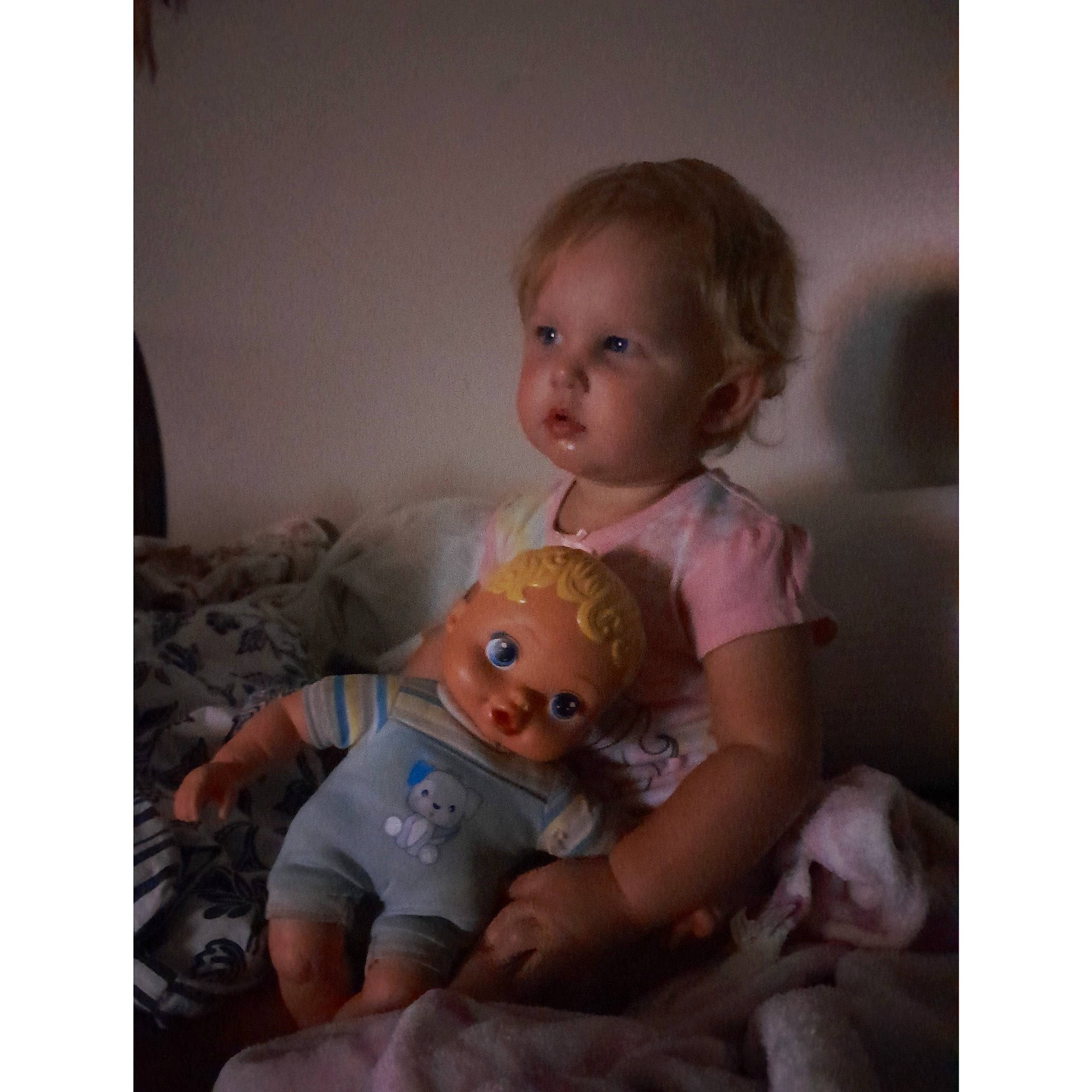 Navie is registered to the contest to win money with this photo: baby, baby_toddler_clothing, cheek, child, comfort, doll, fun, gesture, happy, iris, linens, person, photo_caption, room, sitting, sleeve, stuffed_toy, t_shirt, toddler, toy